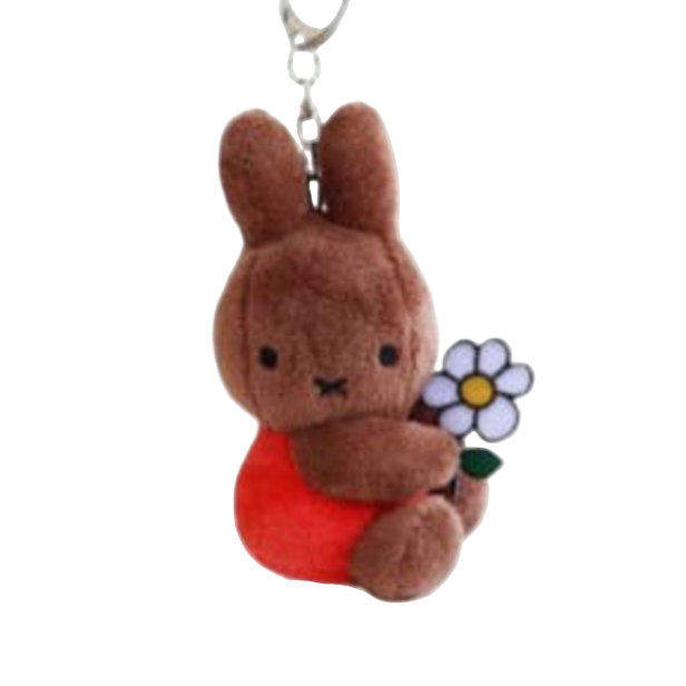 Plush keychains of a brown bunny, white rabbit, and blue character on a white background