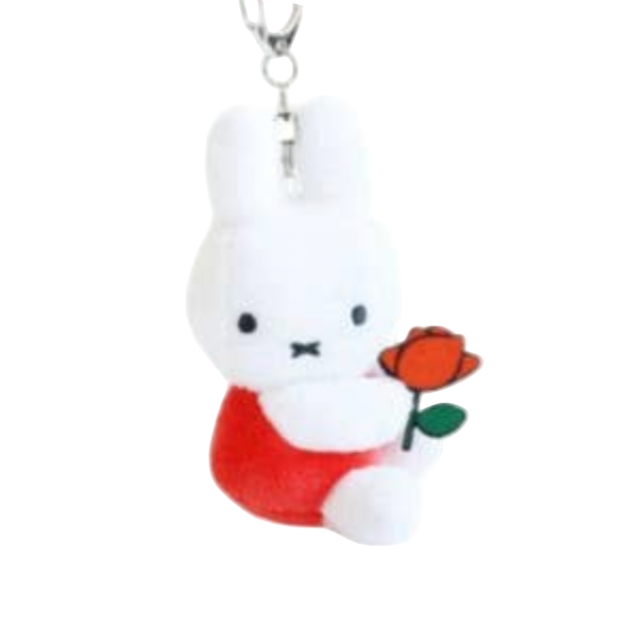 Plush keychains shaped like cartoon characters with colorful outfits and accessories.