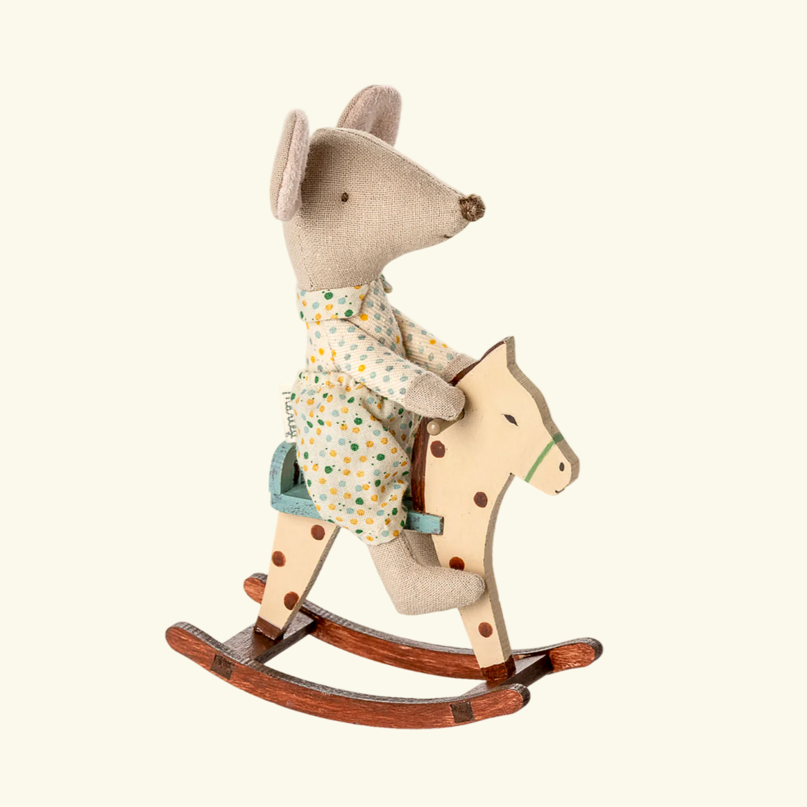 Toy mouse on a rocking horse with a shopping cart interface in the background