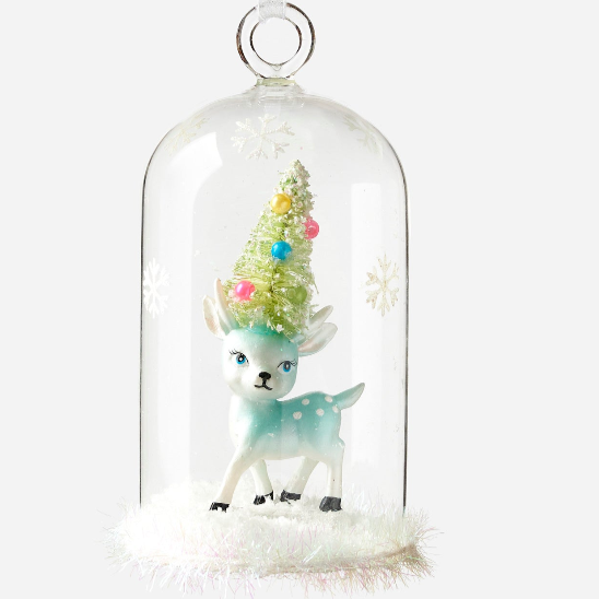 Decorative deer ornament with a colorful tree inside a glass dome on a white background