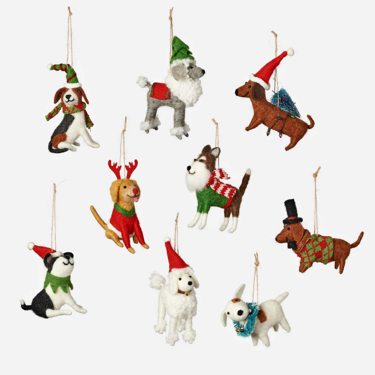 Set of dog-shaped Christmas ornaments on a white background