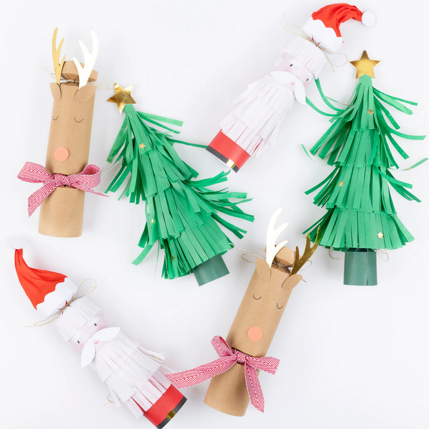 Christmas-themed paper crafts including reindeer and Christmas trees on a white background
