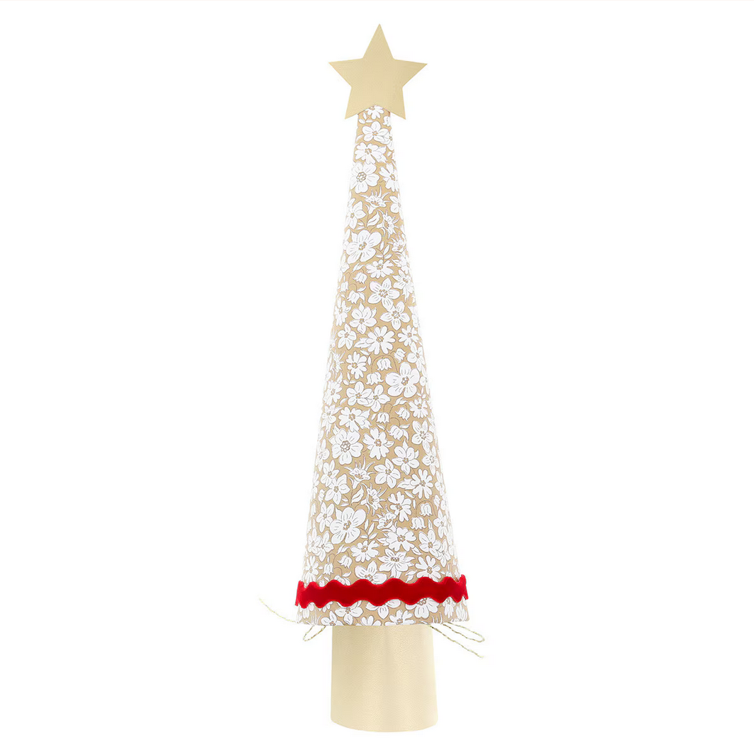 Decorative Christmas tree with white floral design and red base on a white background