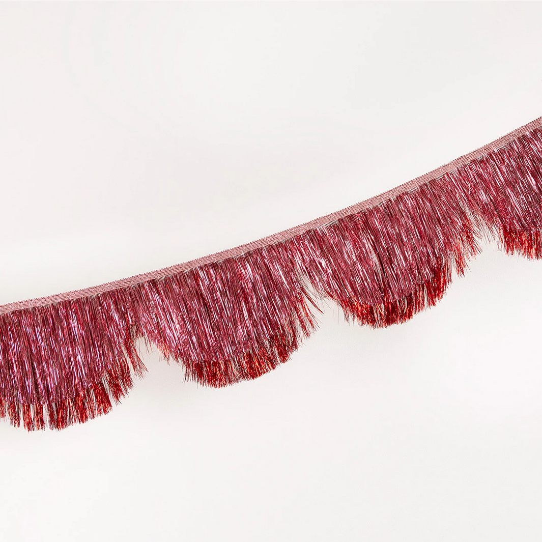 Red fringe trim on a white background