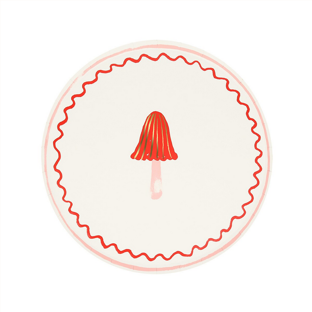 Round plate with red decorative edge and central design on a white background