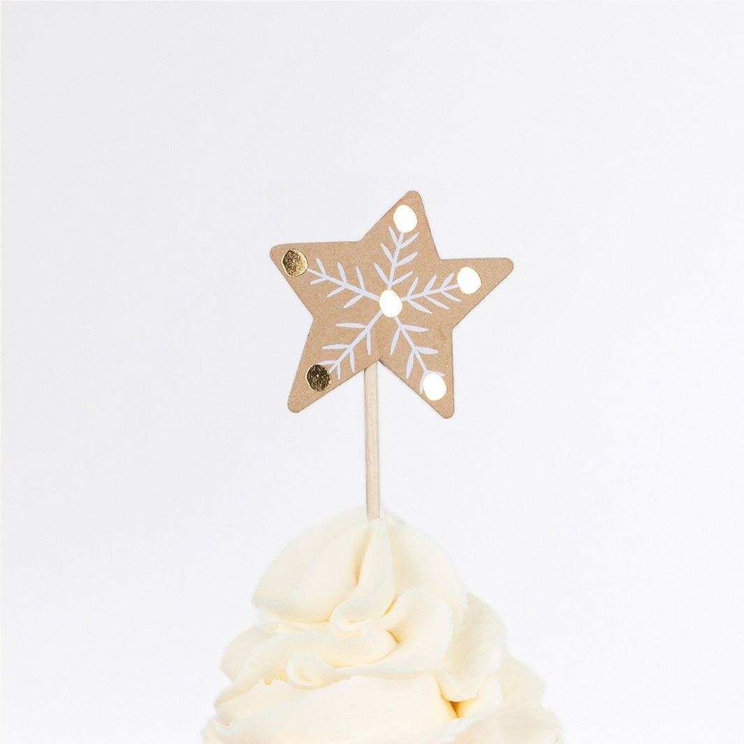 Star-shaped snowflake cake topper on a white background