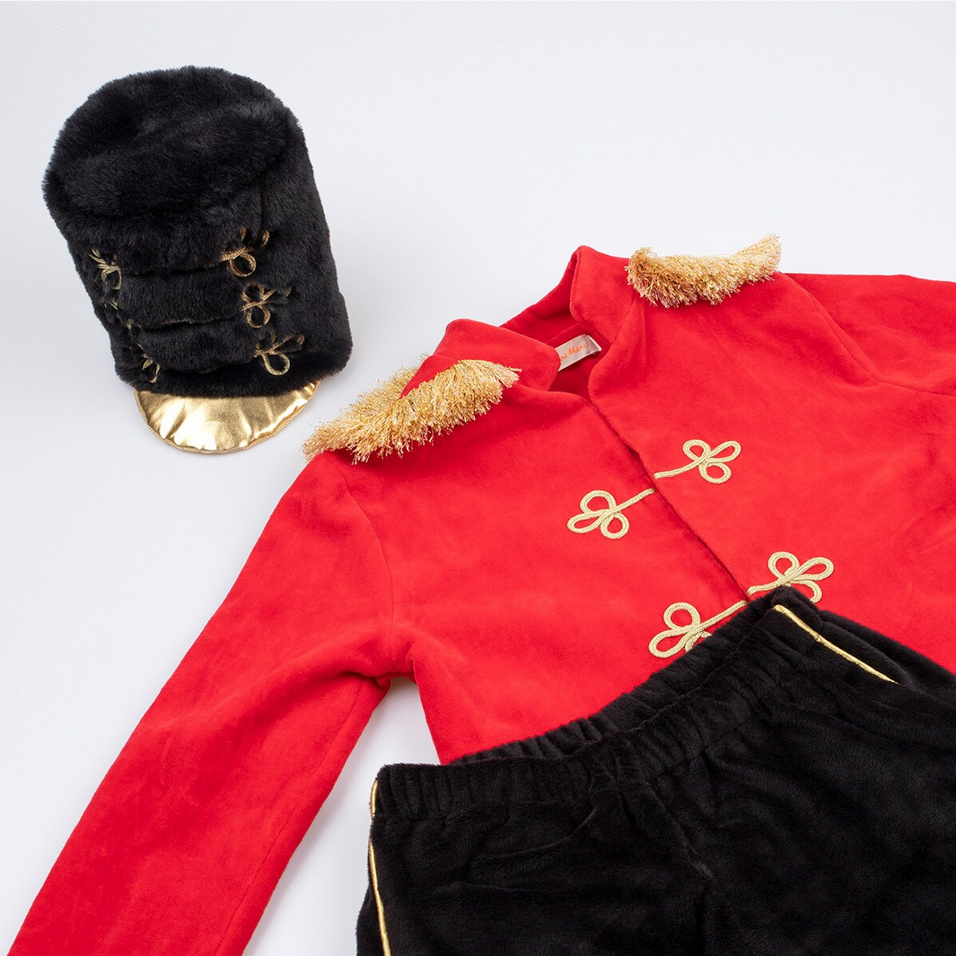 Red velvet outfit with black hat and pants on a white background