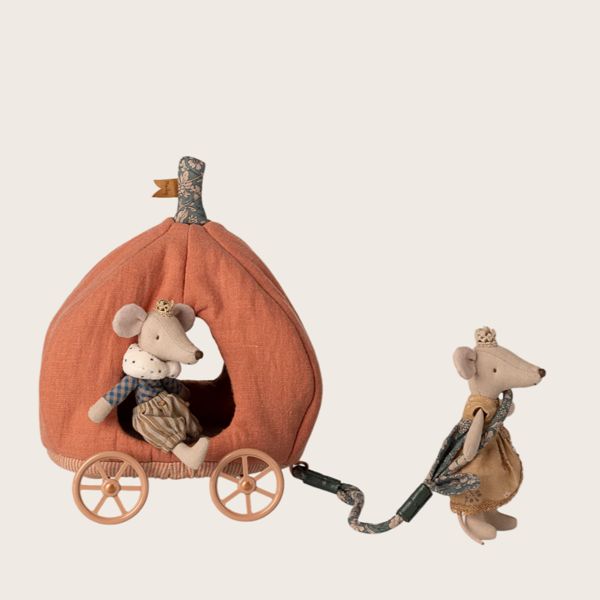 Decorative toy set with a mouse in a pumpkin carriage and another mouse pulling a cart on a light beige background.
