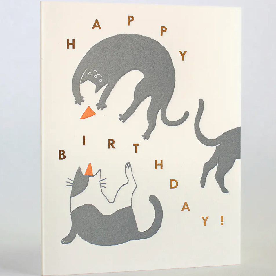 Birthday card with cat illustrations and 'Happy Birthday!' text on a light background