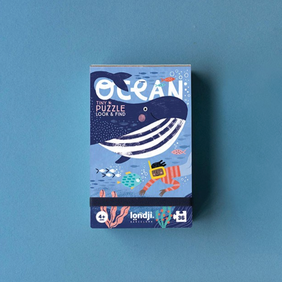 Whale-themed puzzle box on a blue background