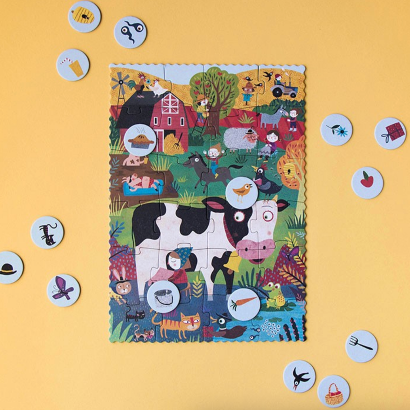 Children's puzzle with a cow on a yellow background
