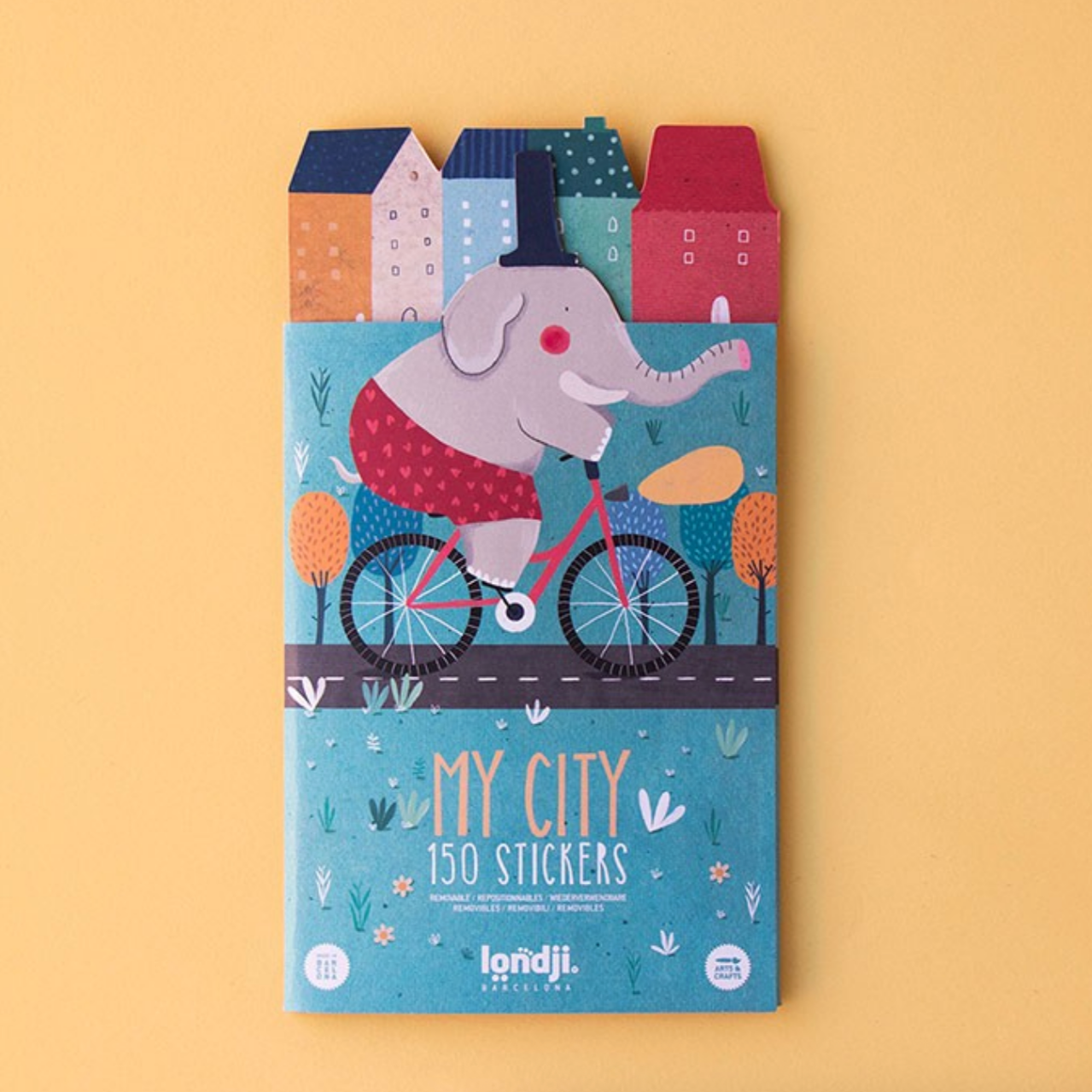 Londji sticker book with an elephant on a bike and colorful houses on a yellow background