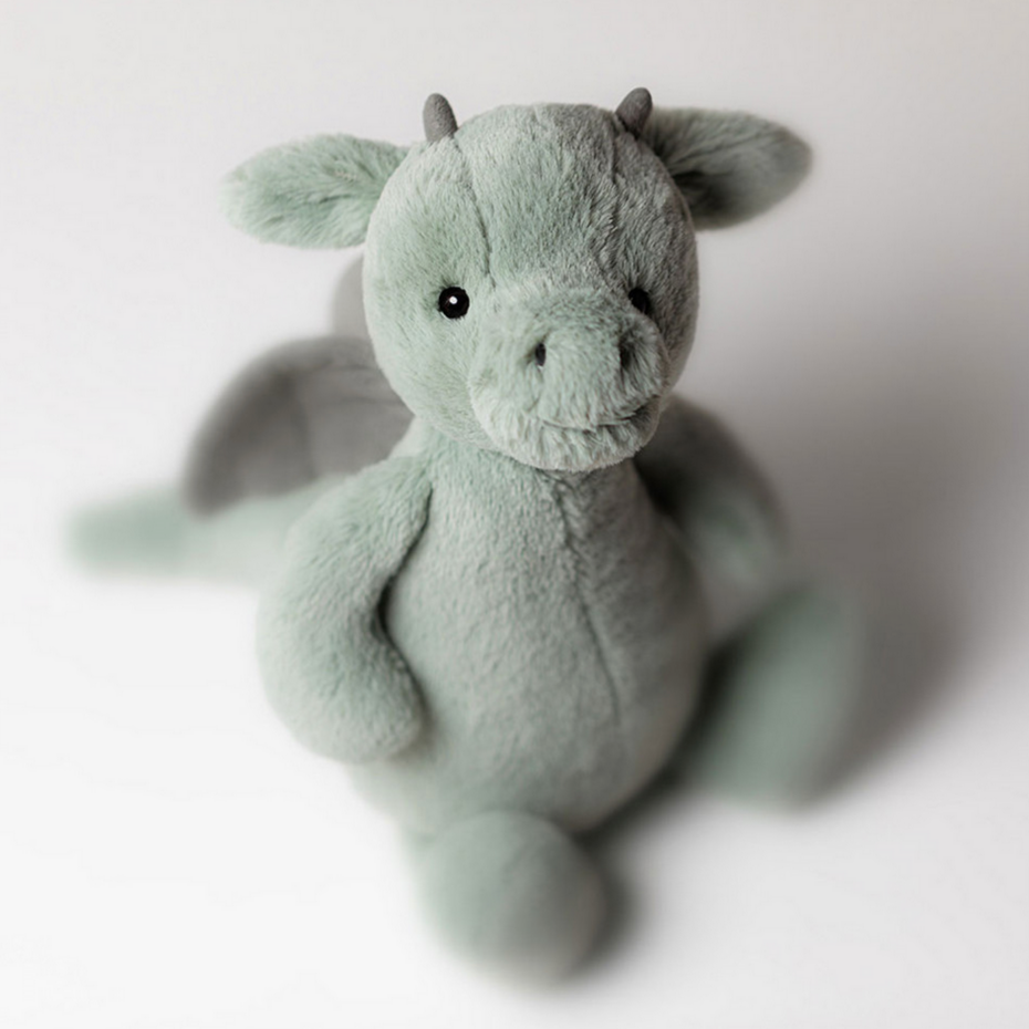 Plush dragon toy on a white background