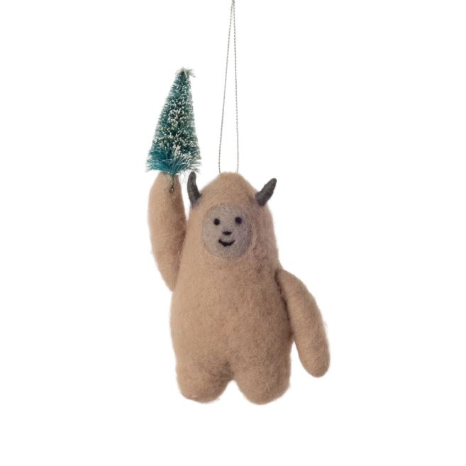 Two plush toy figures of a creature with a small tree on a white background