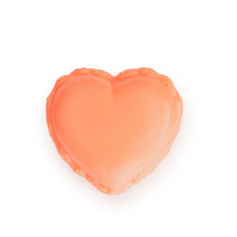 Heart-shaped lip gloss on a white background