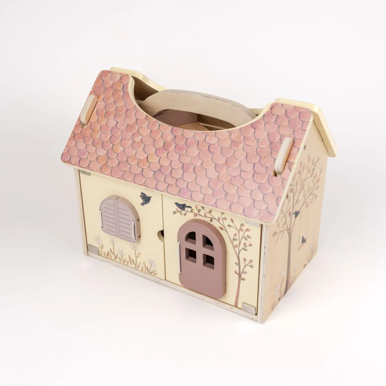 Wooden toy house with pink roof on a white background