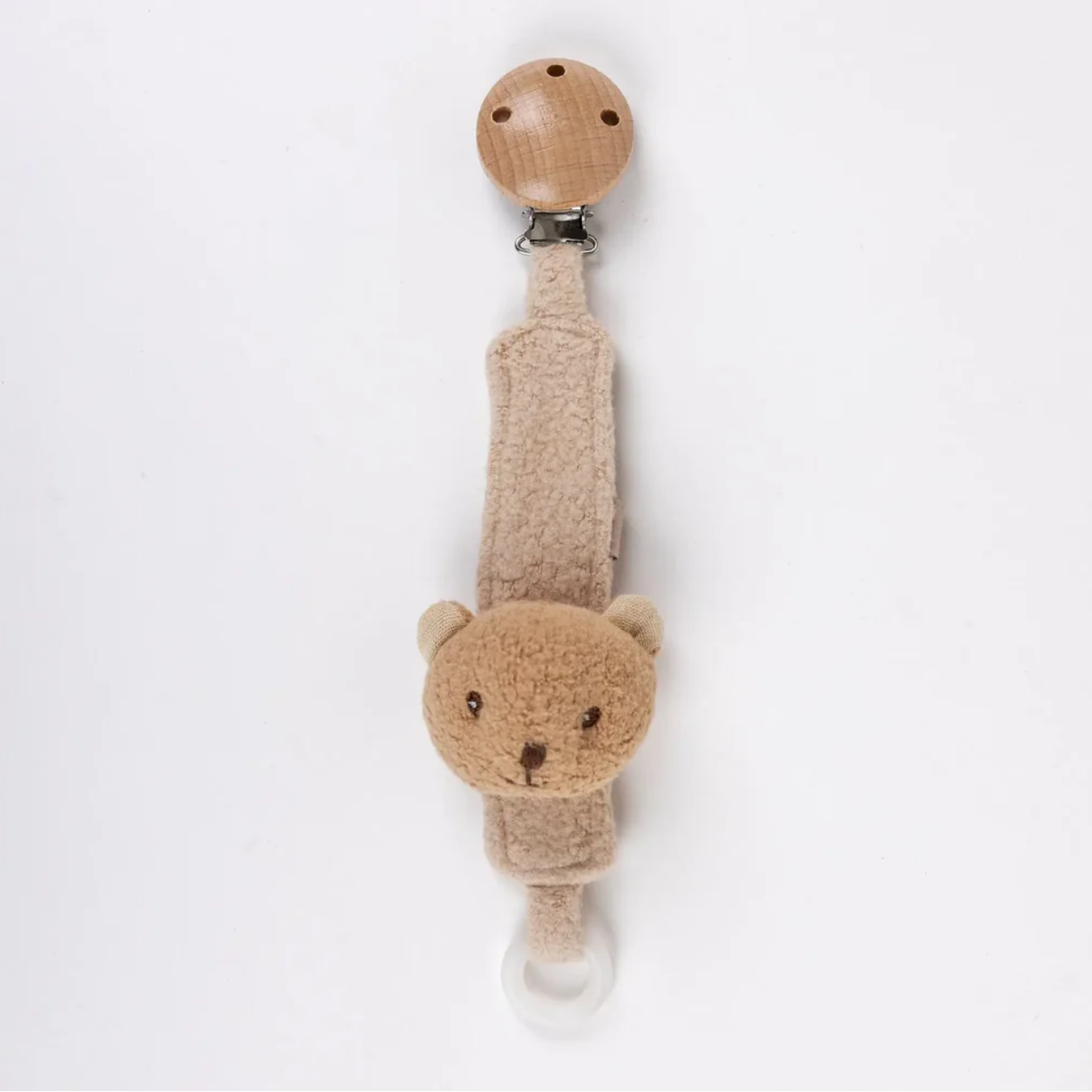Beige teddy bear-shaped pacifier clip on a white background
