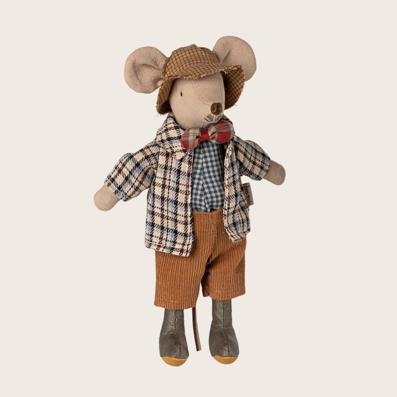 Stuffed toy mouse dressed in a plaid shirt, brown pants, and a hat 