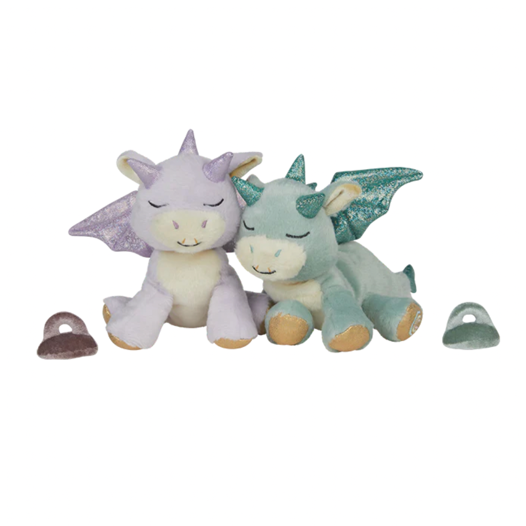 Two dragon-shaped plush toys on a white background 