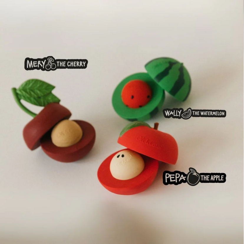 Three colorful fruit-shaped toys labeled 'Mery the Cherry', 'Wally the Watermelon', and 'Pepe the Apple' on a white background.