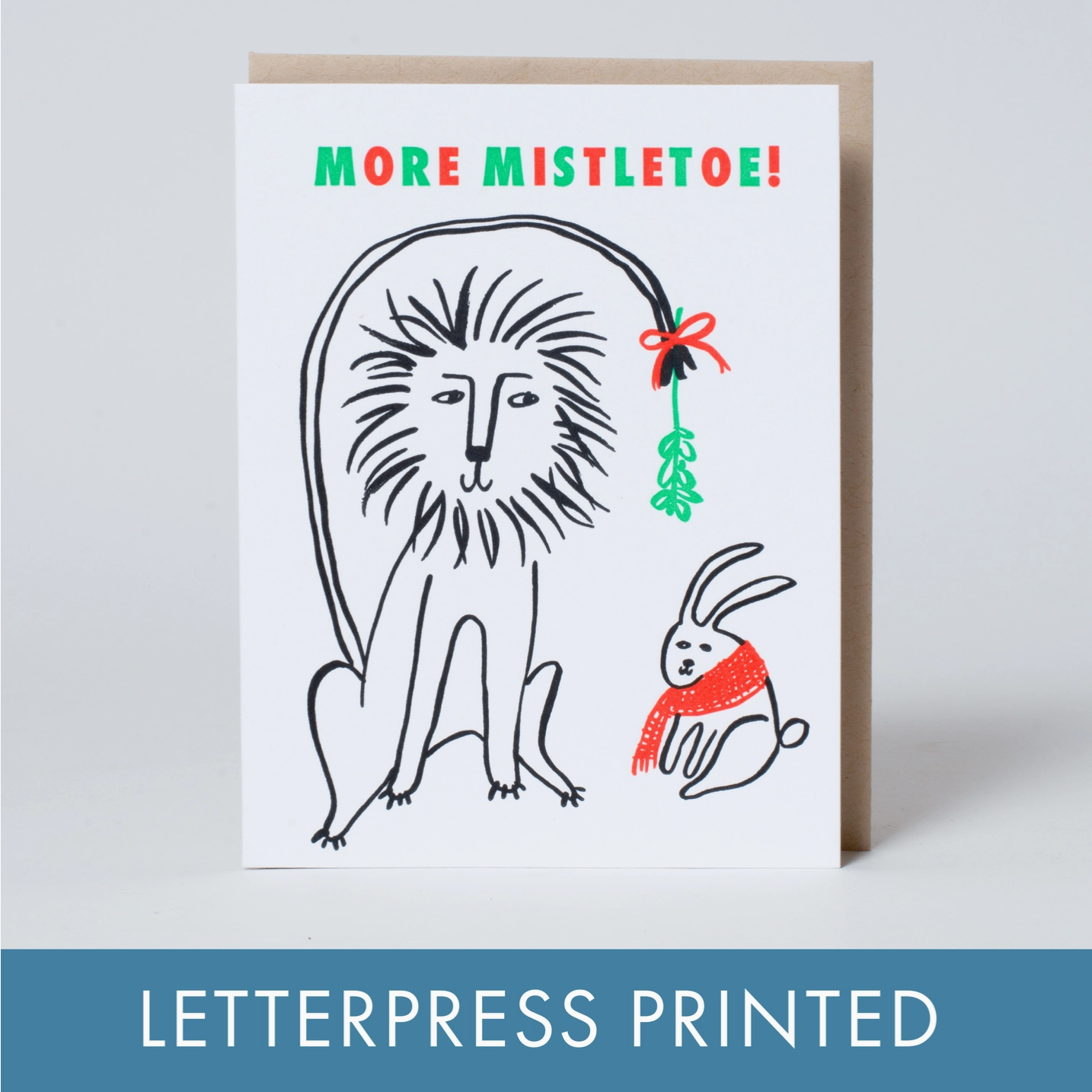 Greeting card with a lion and rabbit illustration and 'More Mistletoe!' text, letterpress printed.