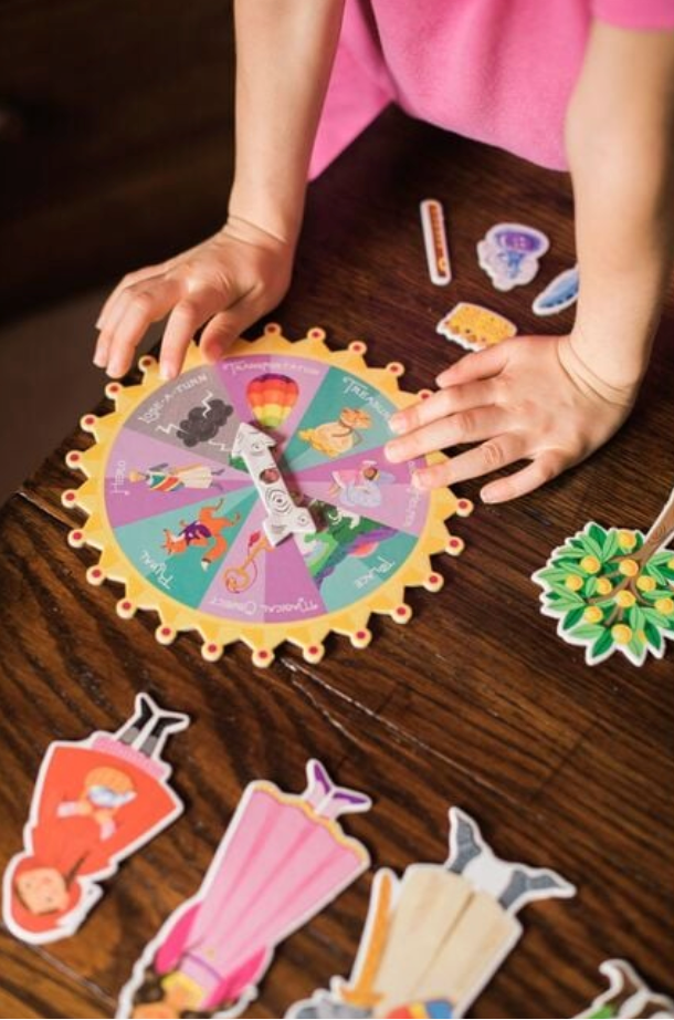 Child playing with a colorful puzzle on a wooden table