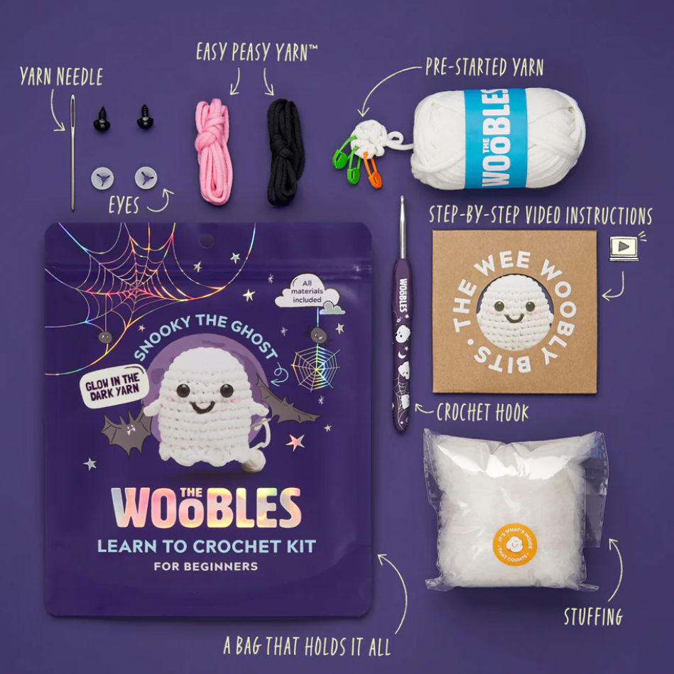 Woobles crochet kit with all components displayed on a purple background