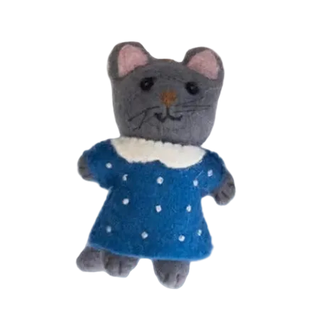 Stuffed toy cat in a blue dress with white polka dots on a white background