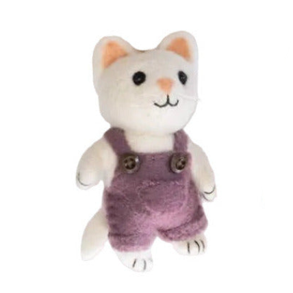 Stuffed toy cat in purple overalls on a white background