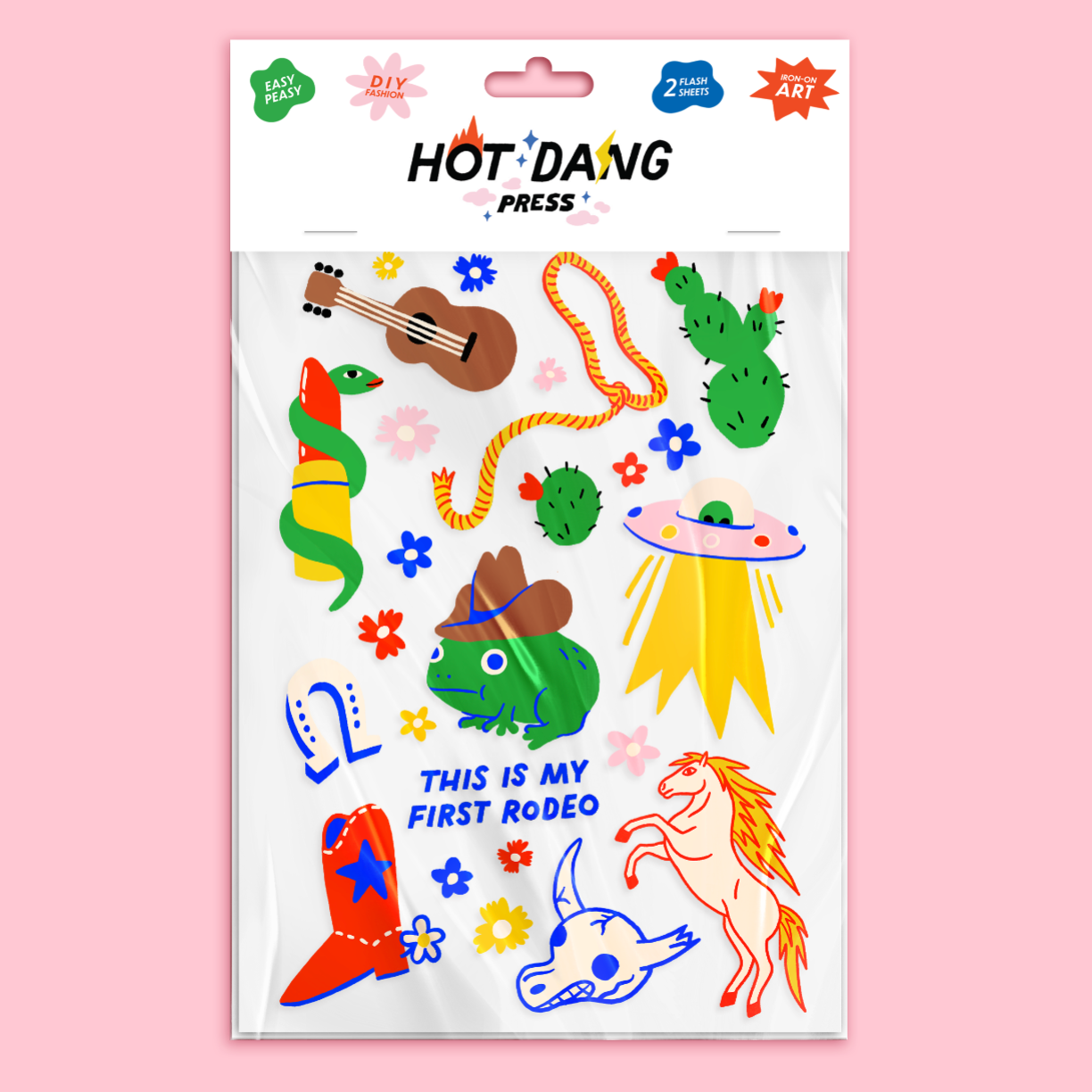 Sheet of colorful iron on's with illustrations on a pink background, featuring the brand 'Hot Dang Press'.