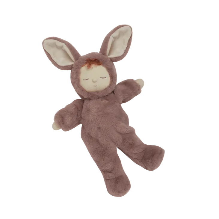 Plush toy in a bunny costume on a beige background