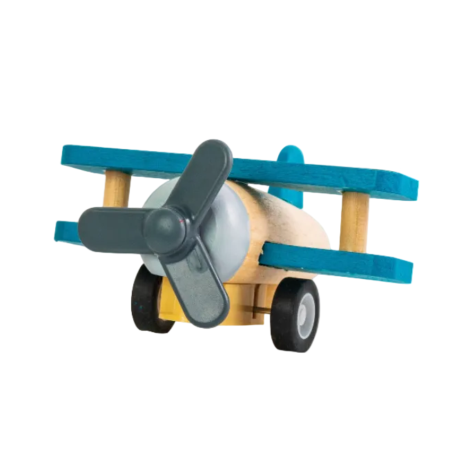 Toy airplane model with a propeller on a white background