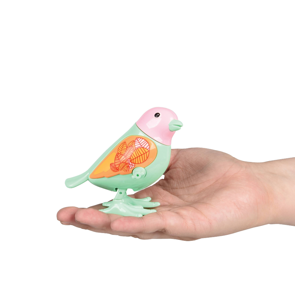 Small bird-shaped toy held in a hand against a white background