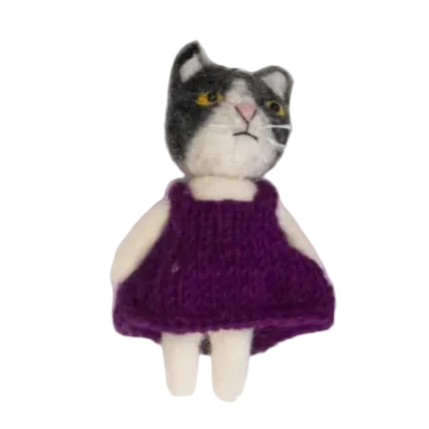 Two small figurines of cats, one in a purple dress and the other in a brown sweater and black pants, on a white background.