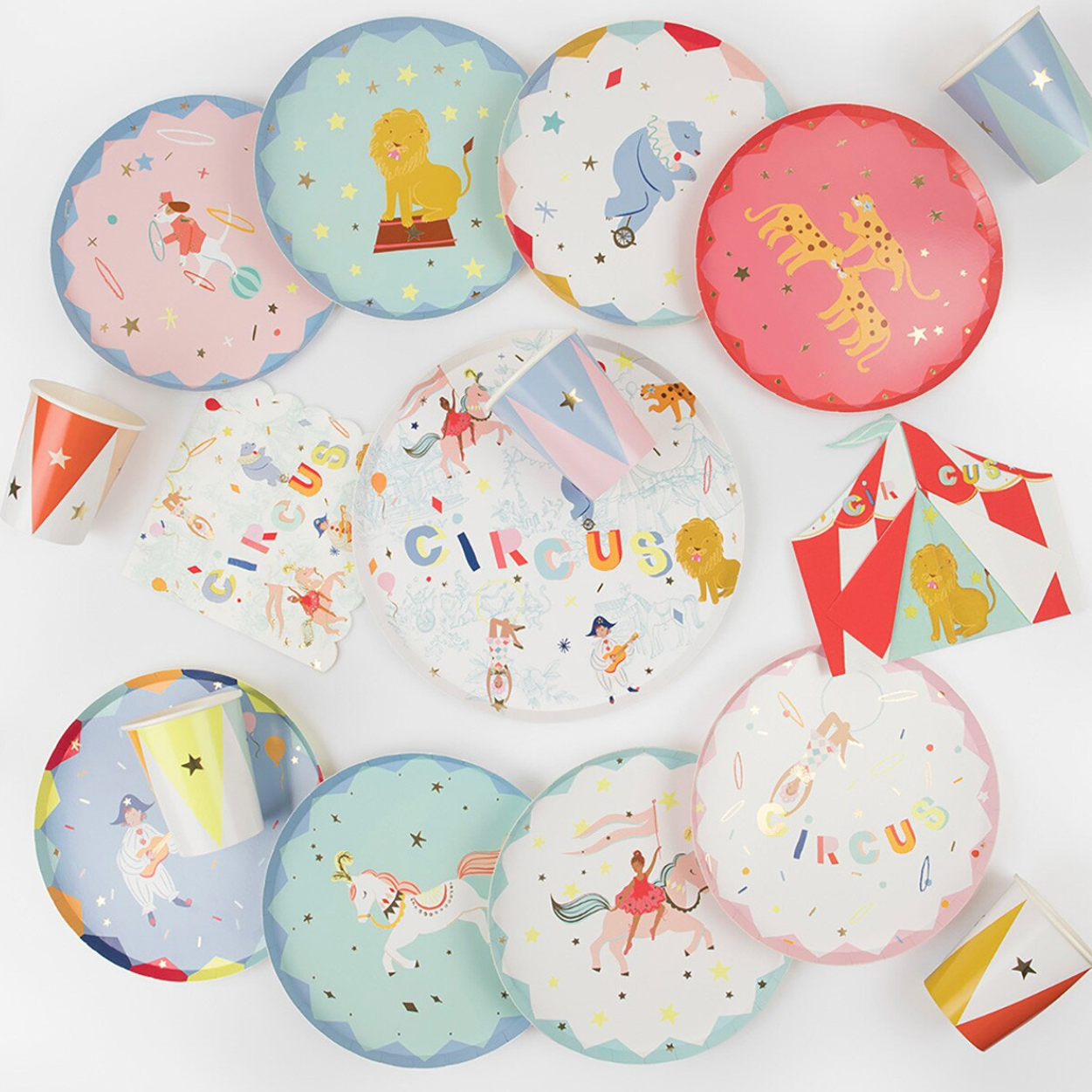 Circus-themed paper plates and flags on a white background