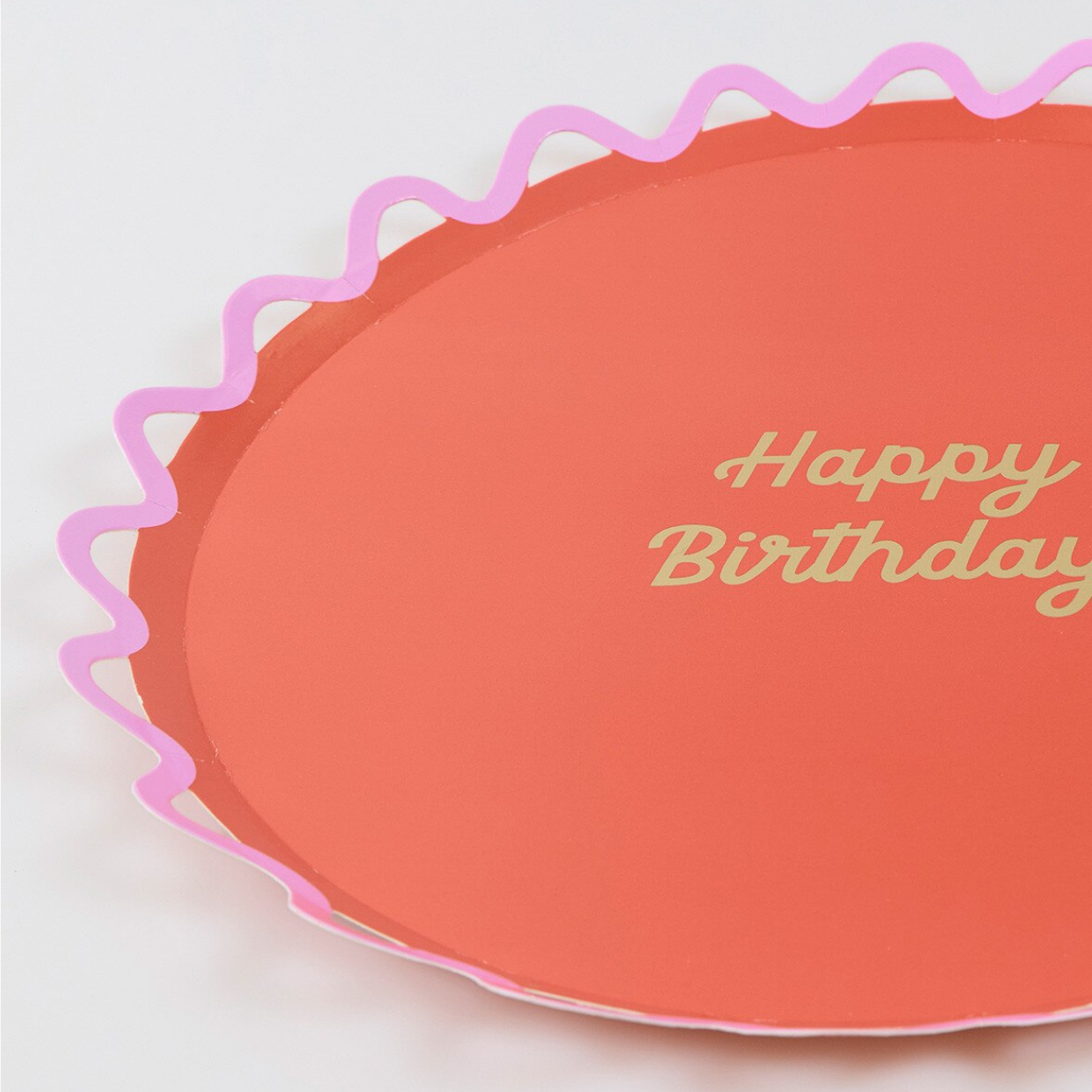 Coral-colored card with 'Happy Birthday' text on a white background