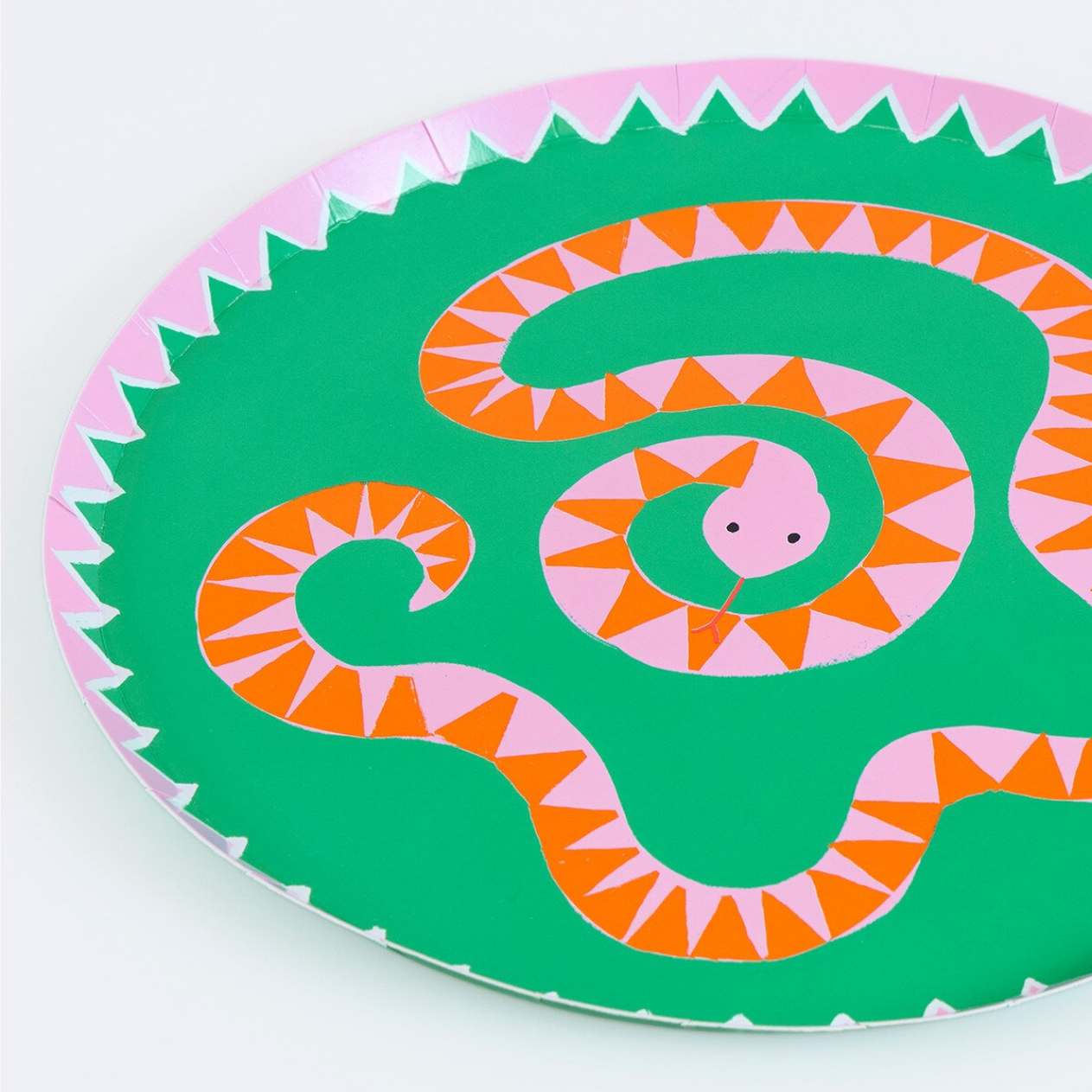 Decorative plate with a snake design on a white background