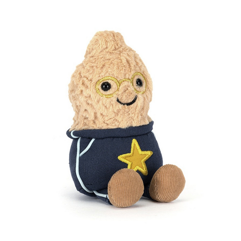 Toy figure of a peanut with a navy outfit on a white background