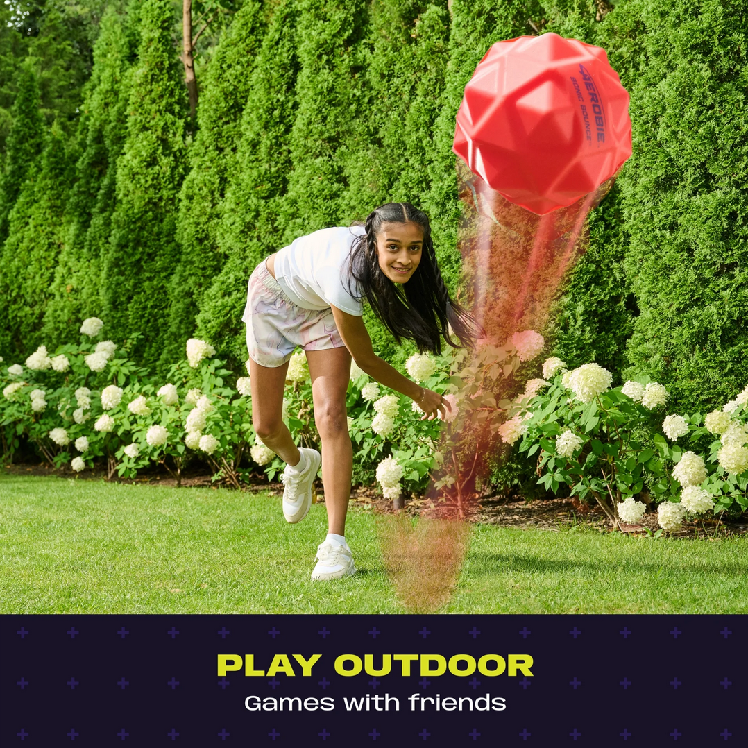 Girl playing with a red ball in a garden with text 'Play Outdoor Games with Friends'.