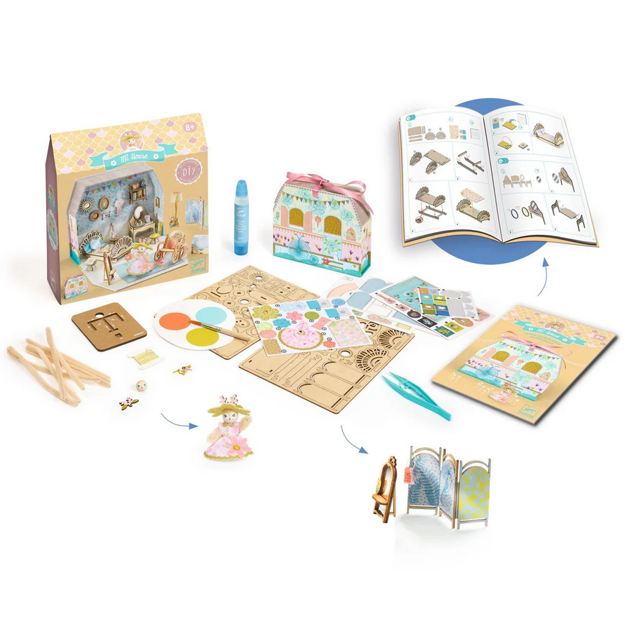 Children's craft kit with materials and tools on a white background