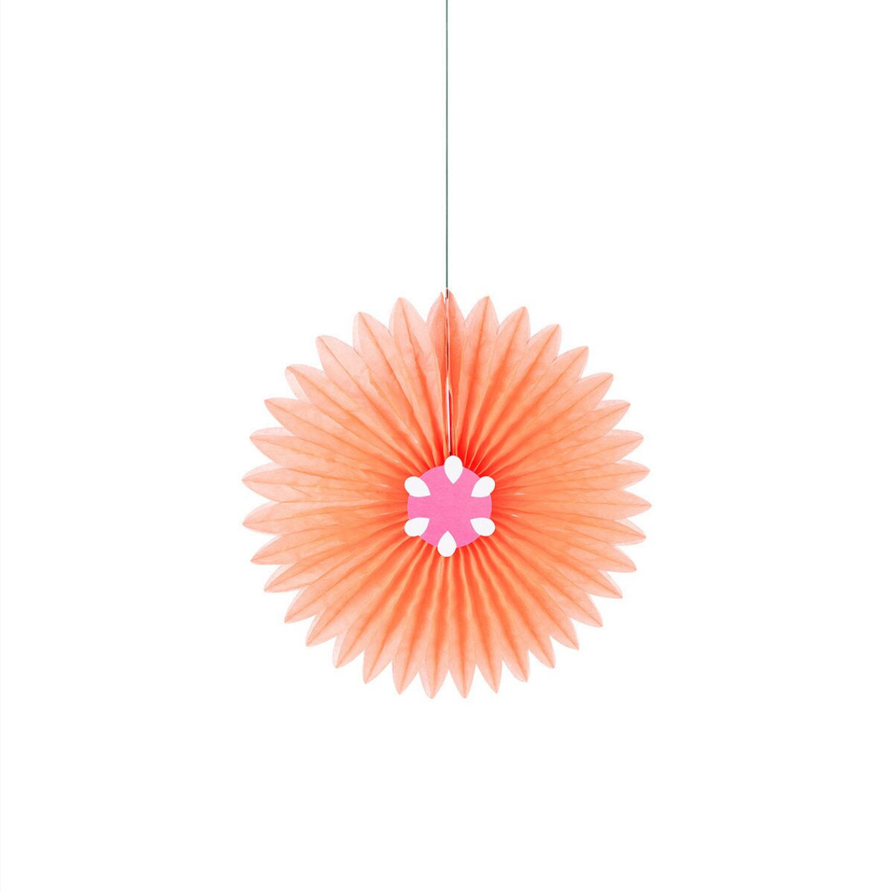 Coral-colored decorative hanging item with a white center on a white background