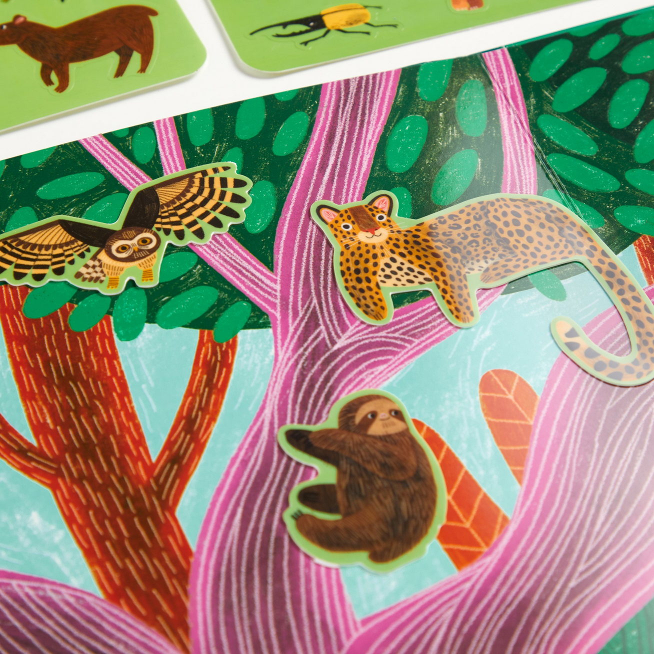 Colorful animal stickers on a tree-like background