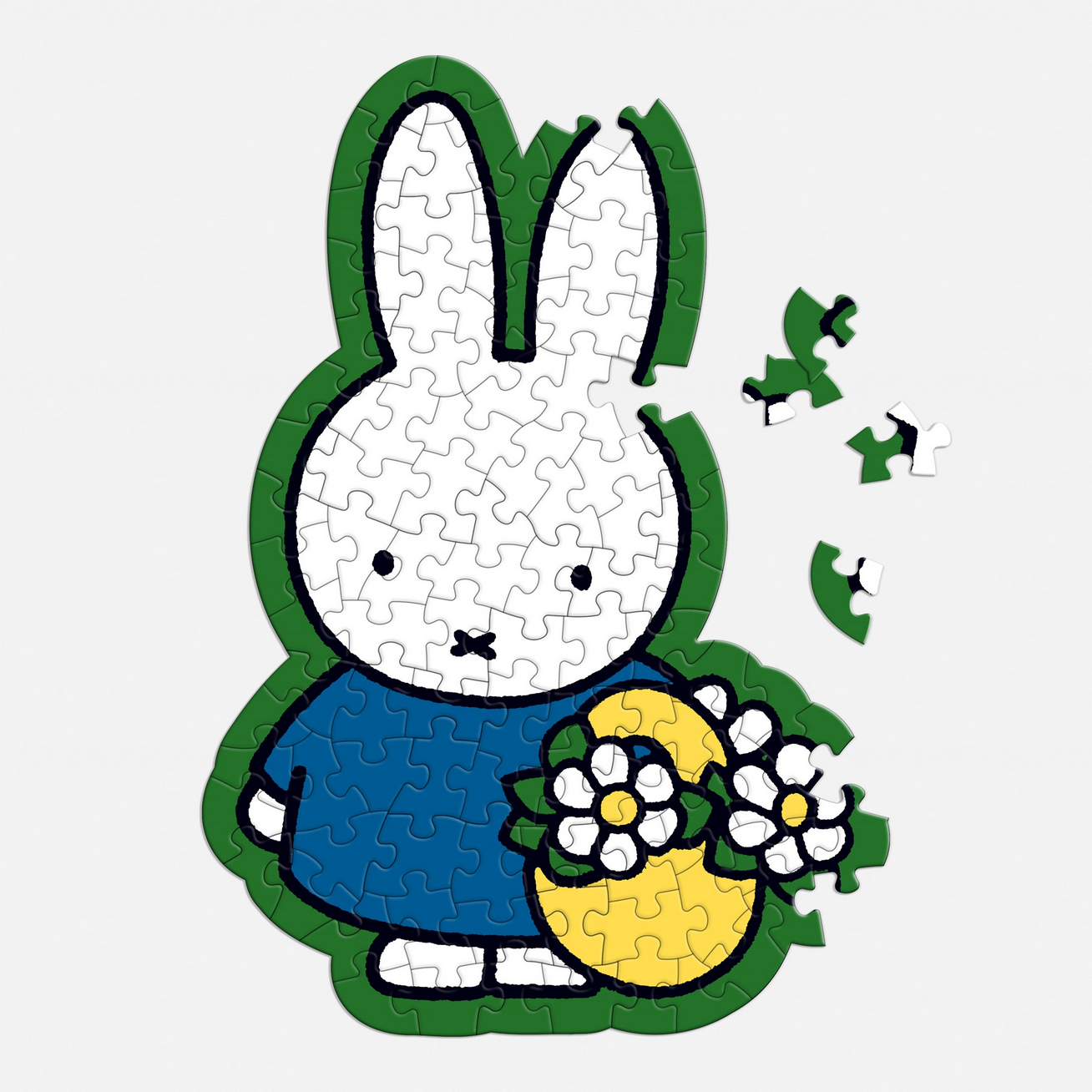 Jigsaw puzzle shaped like a cartoon rabbit holding flowers on a white background