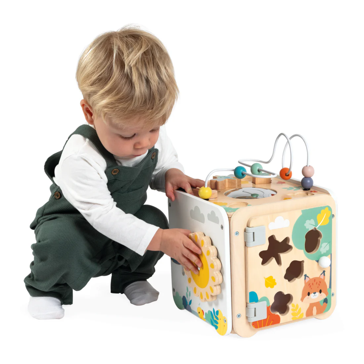 Child playing with a colorful toy cube on a white background