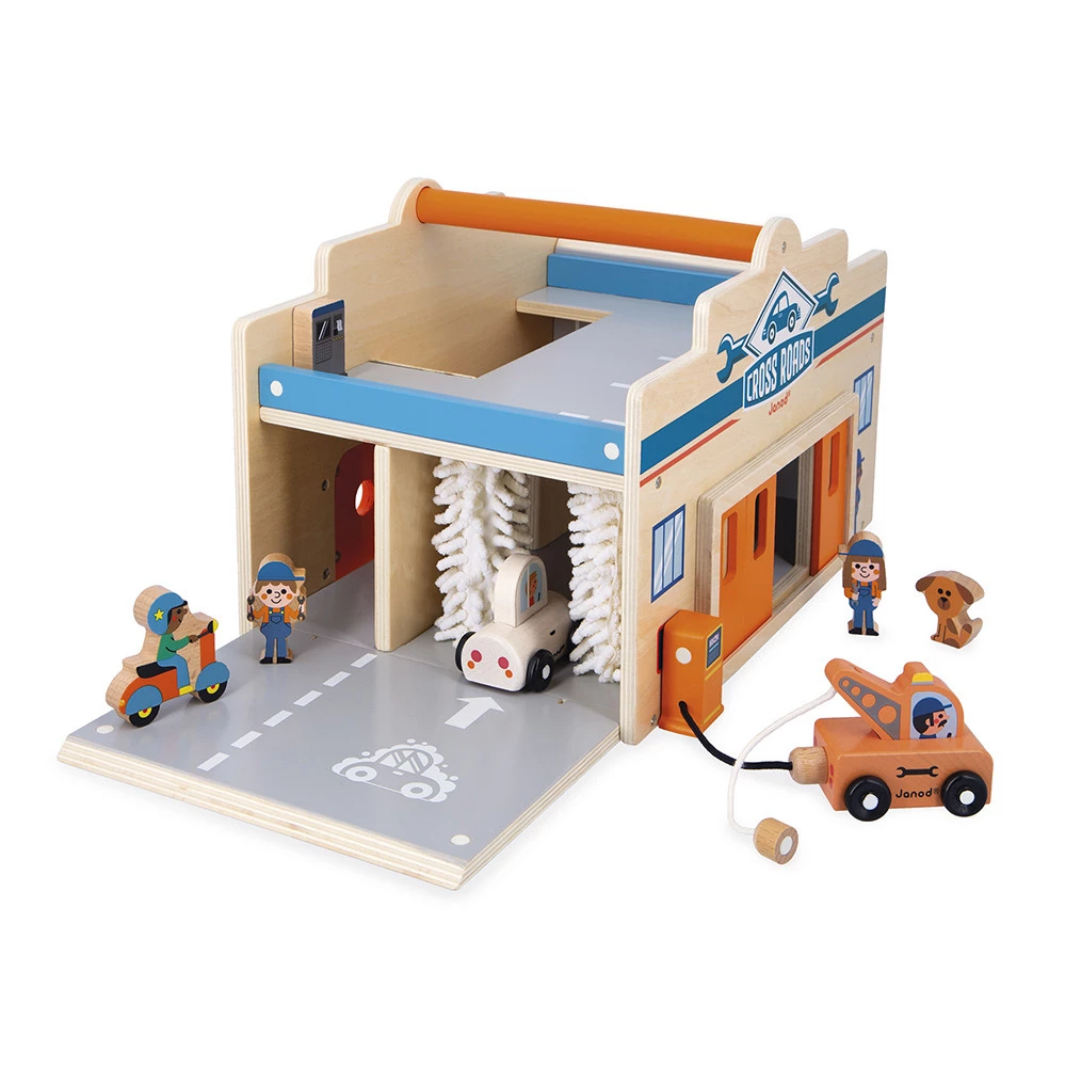Toy car wash set with wooden structure, cars, and figures on a white background