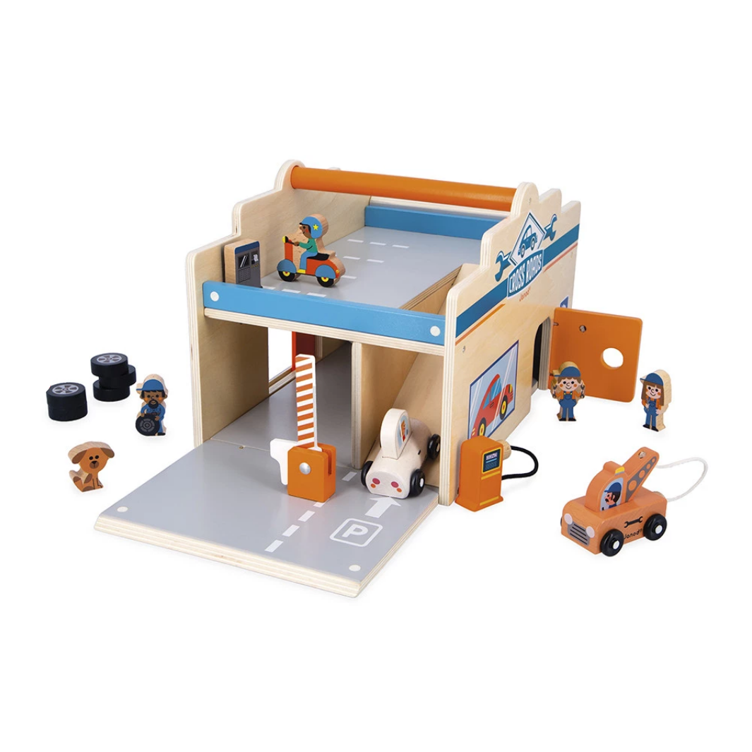 Toy garage set with various toy cars and figures on a white background