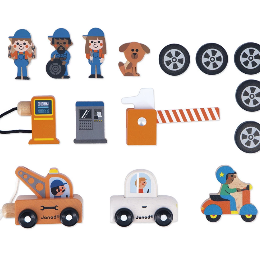 Collection of wooden toy figures and vehicles on a white background