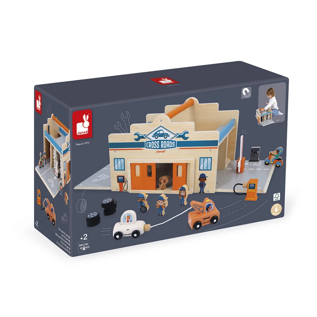 Toy garage set packaging with miniature cars and people on a white background