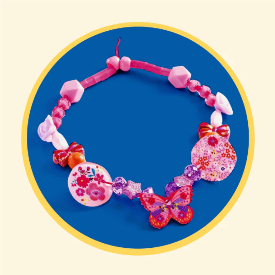 Colorful children's necklace with floral and butterfly designs on a blue background