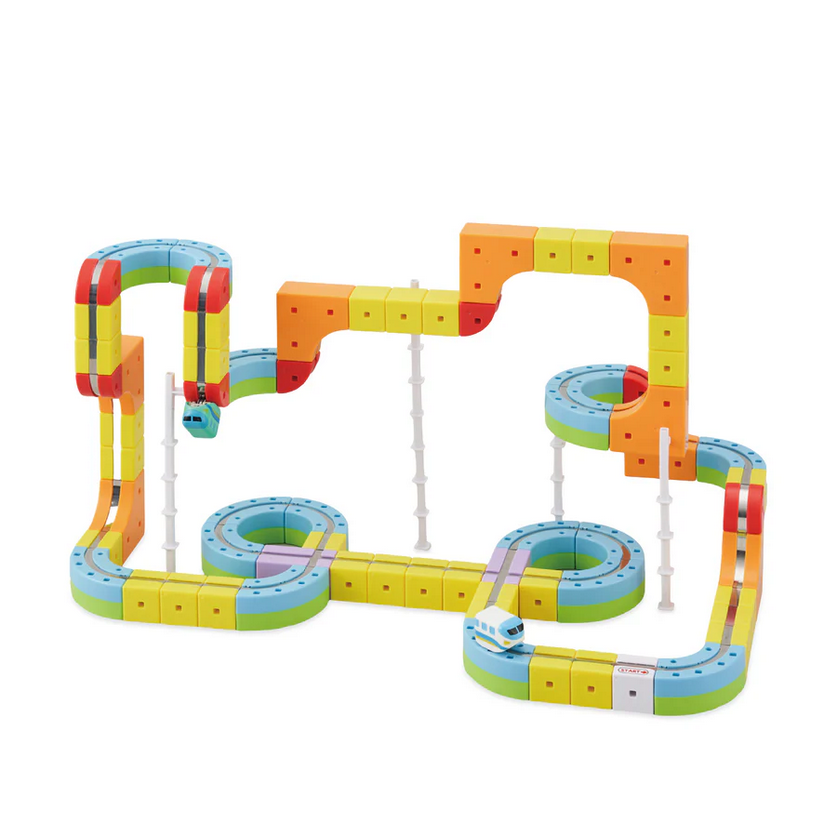 Colorful toy marble track set on a white background